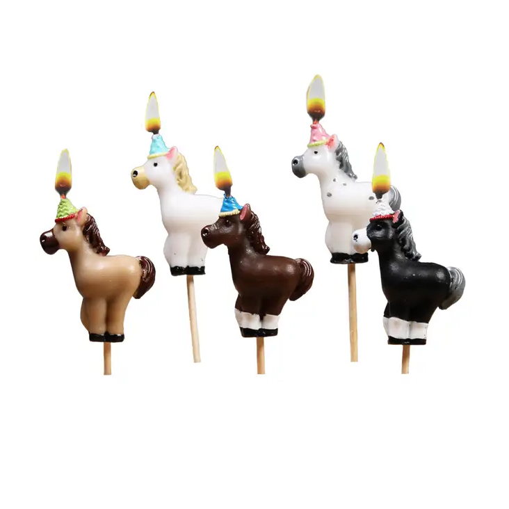 Ponys in Partyhüten Kerzen